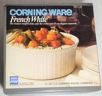 Front of unopened Corning Ware French White 2.5 quart covered round casserole box showing image of casserole with food inside and text.
