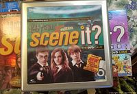 2nd edition Harry Potter Scene It? DVD board game in metal box with cover art featuring Harry Potter, Hermione, and Ron