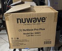 Closed cardboard box with printed NuWave branding and model details.