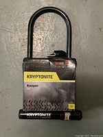 Front view of Kryptonite Keeper U-lock bicycle lock in original packaging showing brand, model, and lock shackle.