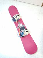 Full view of the pink top of the Burton snowboard with mounted bindings showing overall condition and color.