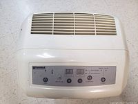 Top view of Kenmore dehumidifier control panel showing buttons and LED display.