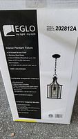Box of Eglo Interior Pendant Fixture Model 202812A with product details and specifications visible