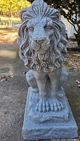 Front view of the lion statue showing full figure and base.
