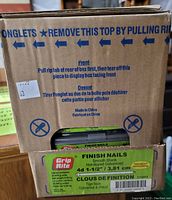 Photo showing box labeled 'Grip Rite Finish Nails' containing 20 packages of 1 1/2 inch finish nails, smooth shank, hot-dipped galvanized, 4d size with tipped points.