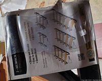 Photo of the packaging showing branding and stair stringer illustrations.