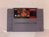 Front view of the Final Fight game cartridge showing label artwork and branding