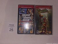 Photo showing both PSP games: Grand Theft Auto Liberty City Stories and Daxter in their cases with Greatest Hits branding.