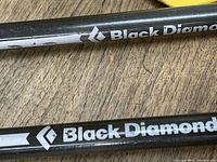 Close-up photo of Black Diamond logo on carbon fiber shaft showing some wear and scratches.