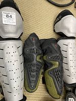 Specialized elbow pads with black/yellow mesh and hard plastic protection