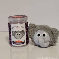 Front view showing Scentsy Bitty Buddy Elephant and scented jar front label.