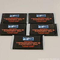 Front view of 5 unopened T2 Terminator 2 Judgment Day movie card packs showing branding and card count.