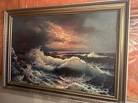 Full front view of framed seascape painting
