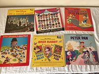 Photo showing six Walt Disney children's LP records including It's a Small World, Donald Duck and His Friends, Brer Rabbit, and Peter Pan.