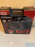 Front view of unopened retail box showing Solid brand cordless drill and driver kit with accessory set.