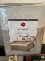 Photo of Clifton king duvet cover and shams in original packaging, beige linen-cotton blend.