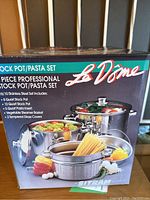 Box front showing the 6-piece professional stock pot/pasta set by La Dome, Sitram of France, including stock pots, pasta insert, vegetable steamer basket, and glass covers with food visuals.