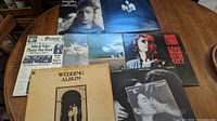Overview of John Lennon albums including Some Time in New York City, Imagine, Mind Games, Live in New York City, Double Fantasy, and The Wedding Album