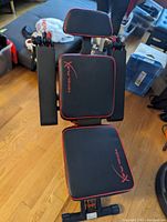 Top-down view of assembled gym bench showing seat and backrest with Total Flex logo and red trim