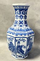 Front view showing detailed painted figures and octagonal shape of vase
