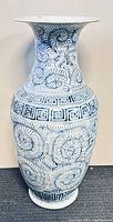 Full front view of blue and white porcelain vase showing overall shape and decorative pattern