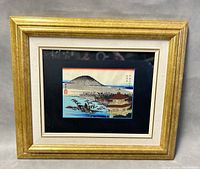 Full view of the framed Japanese wood block print featuring The Temple of the Golden Pavilion in a gold frame with white and dark blue mats.