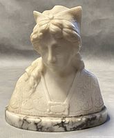 Front view of the vintage resin bust showing detailed carving and stone base
