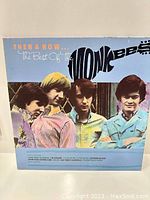 Front cover of Then & Now: The Best of The Monkees LP showing the band members in colorful shirts and the album's title.