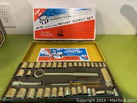 40-piece vintage ratchet socket set displayed in yellow carrying case with original packaging box behind.