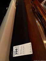 Top angled view of Yamaha sound bar with MaxSold auction label showing size 35 x5.5 x2.5