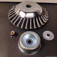8 inch steel wire brush cutter trimmer head with twisted bristles, metal body, and mounting nut, washer, and cover.