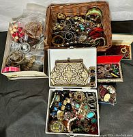 Wicker basket close-up of bracelets, watch bands and faux pearl strands