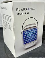 Box front showing Blaux Classic Desktop AC with image of portable air chiller unit.