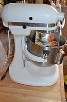 Front view of mixer with bowl and cookbook
