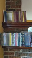 Photo showing two shelves of DVDs with mostly educational and historical documentaries including The Great Courses collection and others.