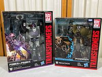 Power of the Primes Rodimus Unicronus and Studio Series Megatron unopened in original packaging side by side.