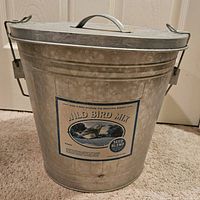 Front view of aluminum bucket with lid, featuring label 'Wild Bird Mix'