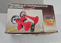 Box showing the Fiamm branding, model details, and image of the air horns on the front, with some wear visible.