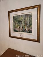 Full view of framed print showing Blue Heron and forest scene.