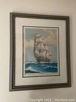 Framed print showing the entire artwork and frame on a wall.