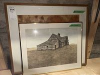 Framed original abstract art and framed art print showing front view of both artworks leaning against a wall.