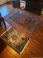 Two Safavieh Mahal rugs on hardwood floor, larger and smaller, showing overall pattern and size difference