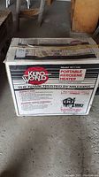 Boxed Kero World portable kerosene heater showing model KC1100 and branding on box.
