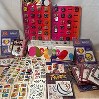 Wide view of the vintage temporary tattoos, stickers, novelty rings on display boards, and gel nail polish bottles