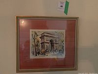 Full view of one vintage framed watercolor painting depicting L'Arc du Triomphe in Paris with street scene, trees, and pedestrians.