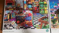 Pizza Arcade 1500-piece puzzle box showing colorful arcade and pizza themed illustration.