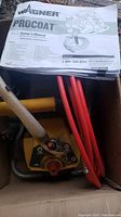 Wagner ProCoat Paint Sprayer unit with hoses and owner's manual on top, inside original box.