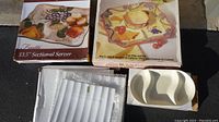 Four serving platters presented together, including boxed and unpackaged items.