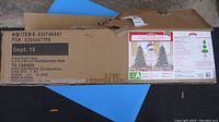 Box showing 6.5 ft pre-lit Sonoma Pine Tree made in China, gross weight 5.0 kgs.