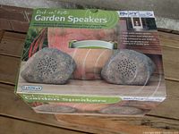 Box of Gardman Rock outdoor/indoor garden speakers with imagery of two rock-shaped speakers and product details.